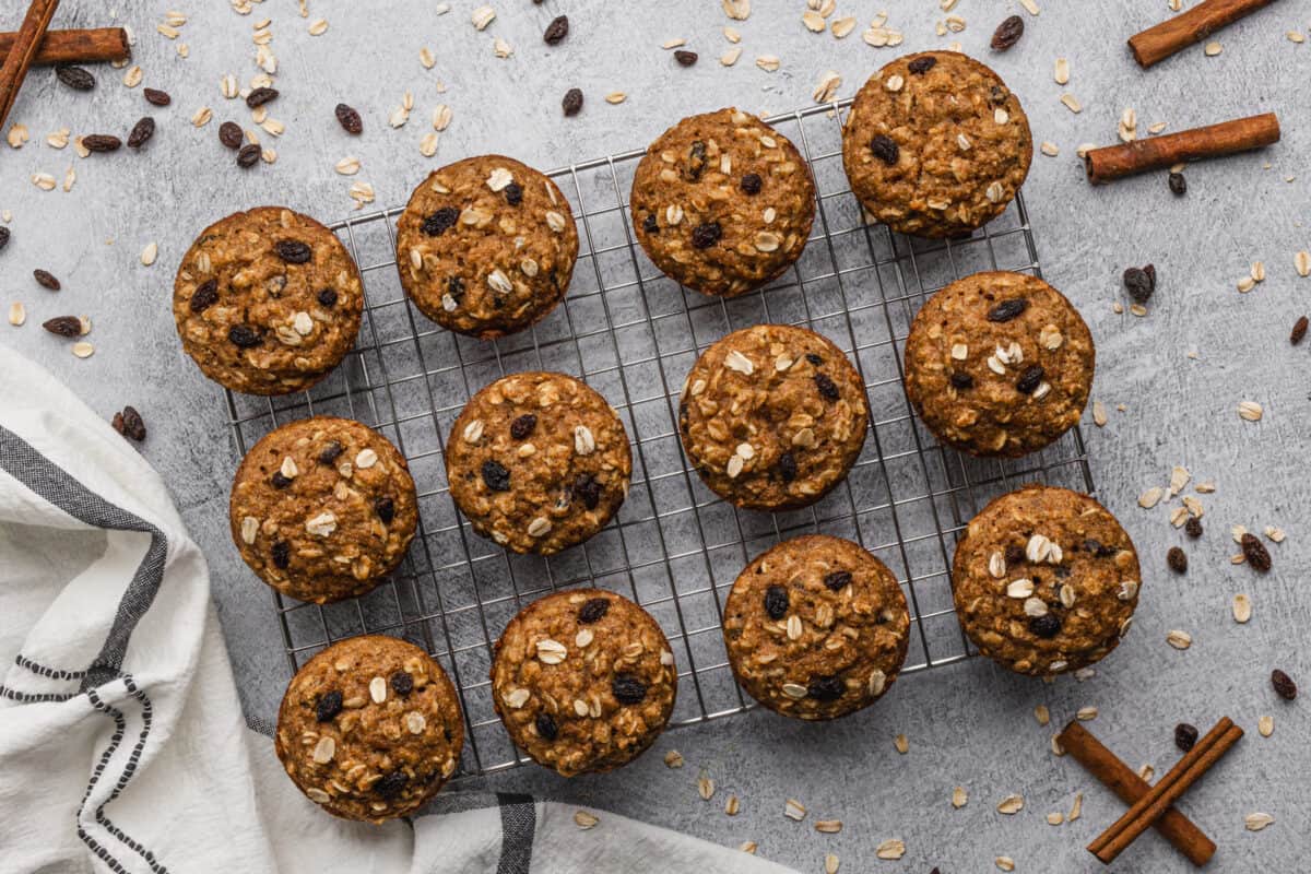 Oatmeal Applesauce Muffins fresh out of the oven, cooling on a baking sheet.