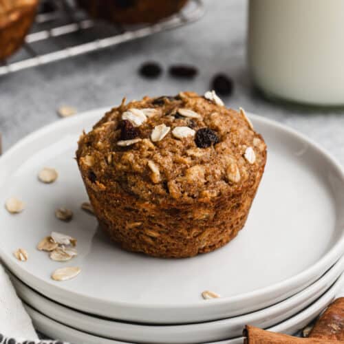 An easy Applesauce Muffin on a plate, ready to enjoy.