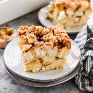 A piece of easy Baked French Toast Casserole on a small white plate.