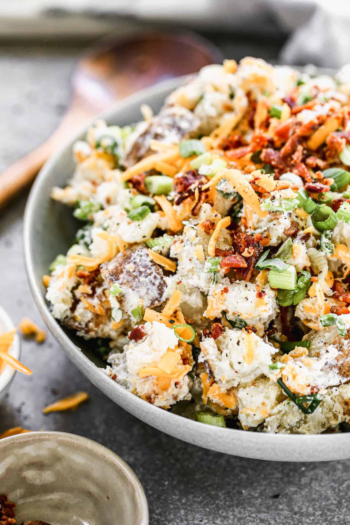 A close up image of loaded Baked Potato Salad, ready to enjoy. 