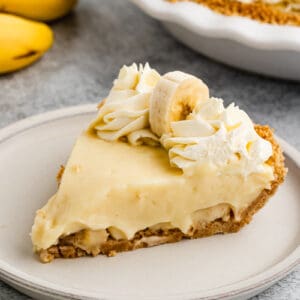 A slice of homemade Banana Cream Pie on a plate, ready to enjoy.