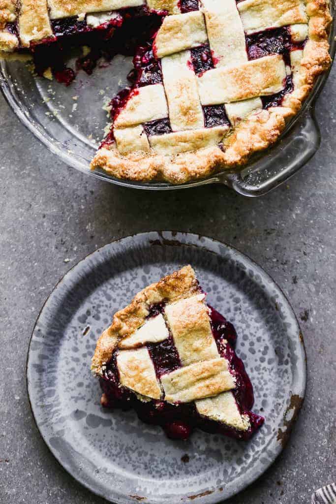 Overhead photo of a slice of berry pie on a plate.