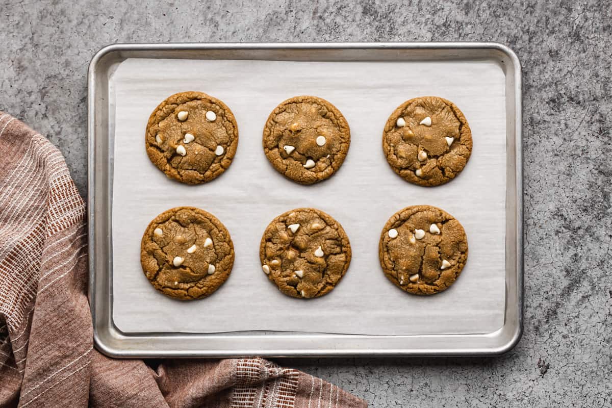 Freshly baked biscoff stuffed cookies on a baking sheet.