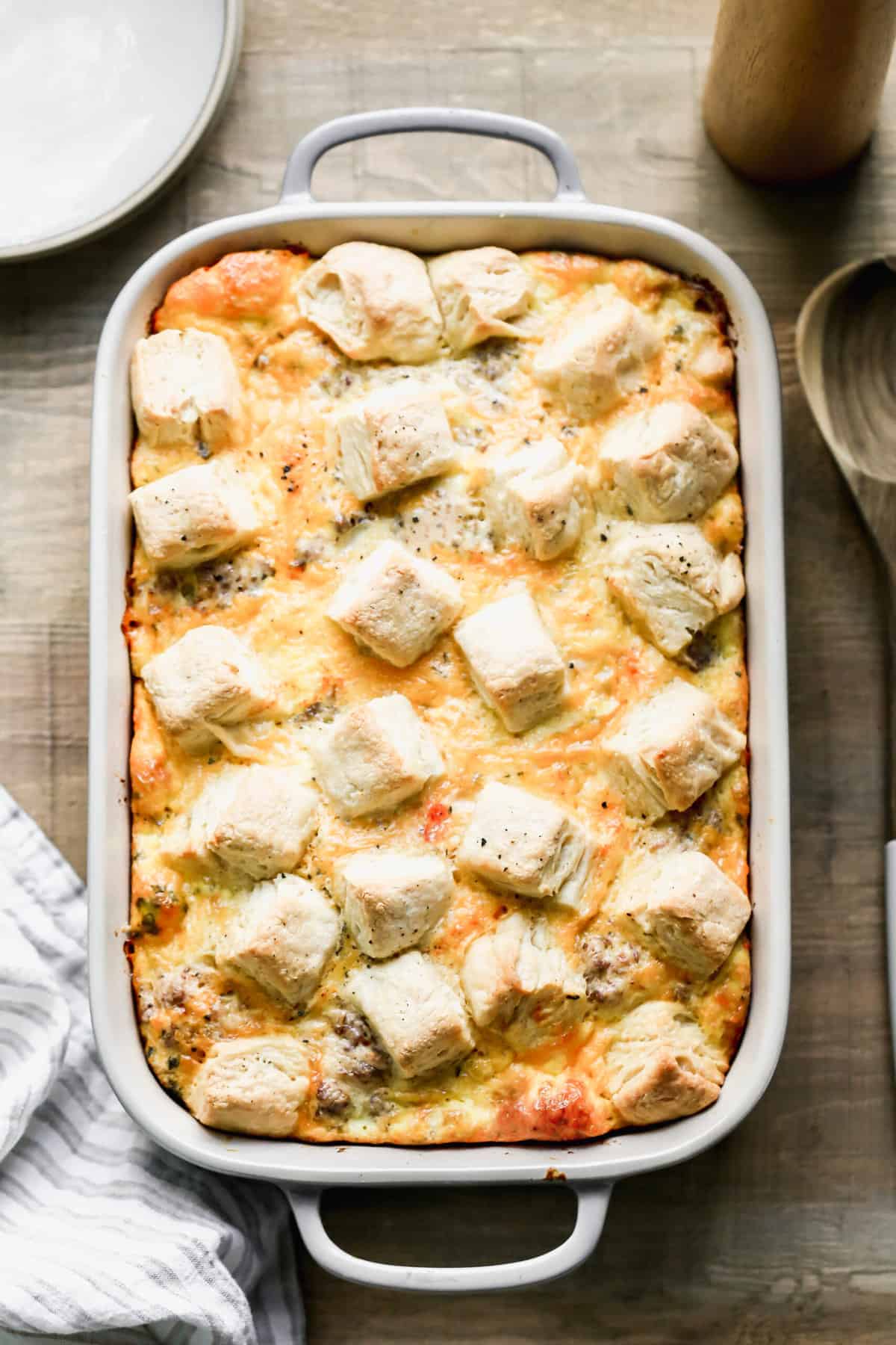 A 9x13 white baking dish filled with easy Biscuit and Gravy Casserole.