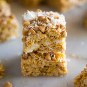 Two cereal bars stacked on each other with more bars in the background.