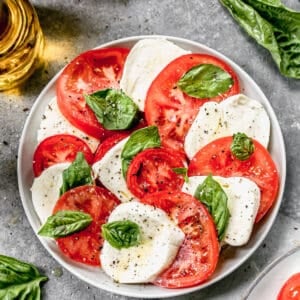 Caprese Salad made fresh, on a plate.