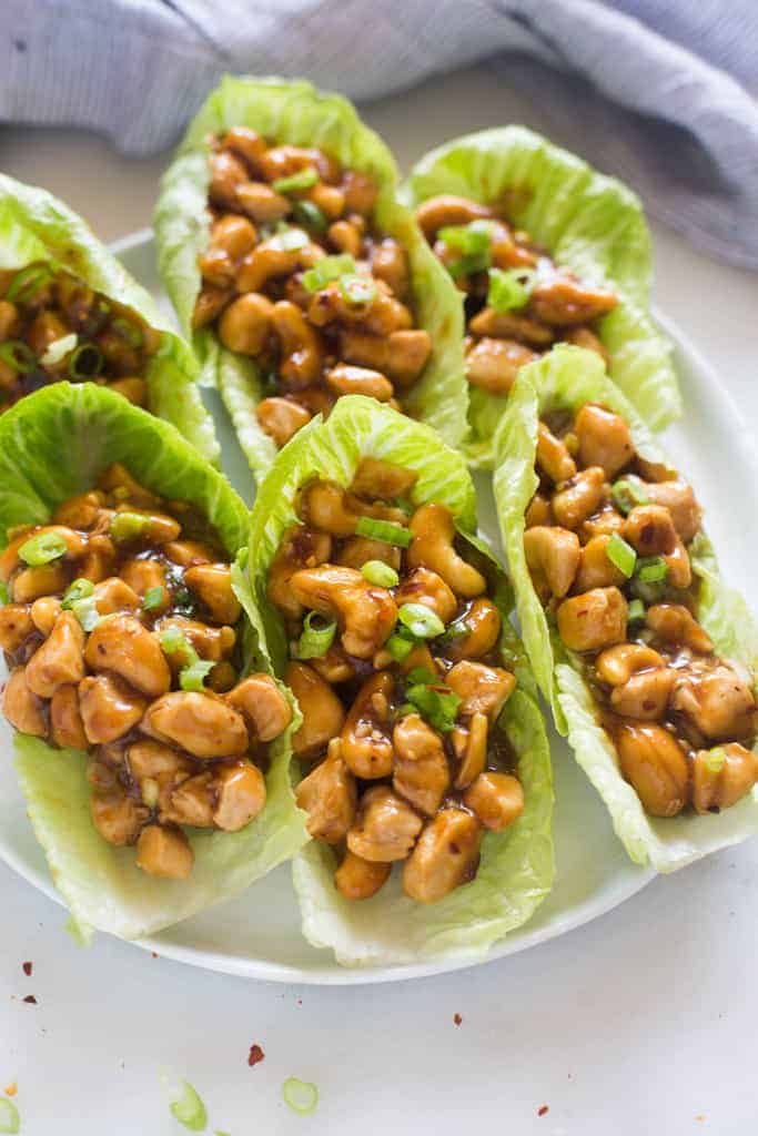 Cashew Chicken Lettuce Wraps on a white plate.