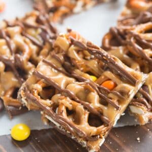 Peanut Butter and chocolate pretzel bars with Reese's pieces candy are one of our favorite simple, sweet and salty treats! | tastesbetterfromscratch.com