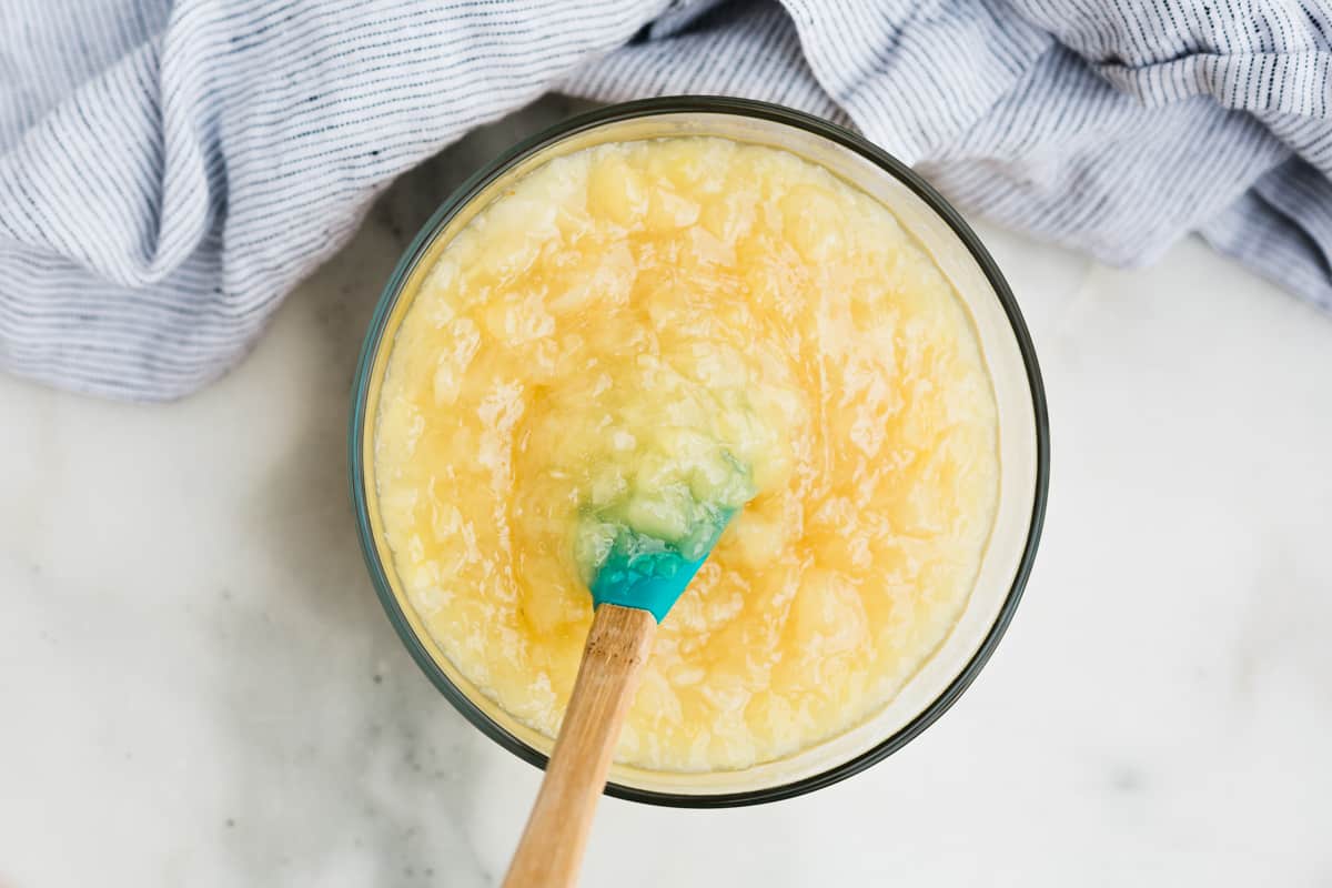 A delicious pineapple filling in a glass bowl to make homemade Coconut Cake with pineapple filling.