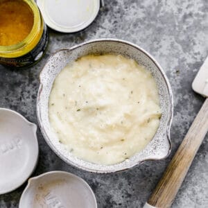 A bowl of Cream of Chicken Soup Substitute on the counter.