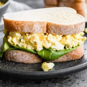 An Egg Salad Sandwich on a plate.