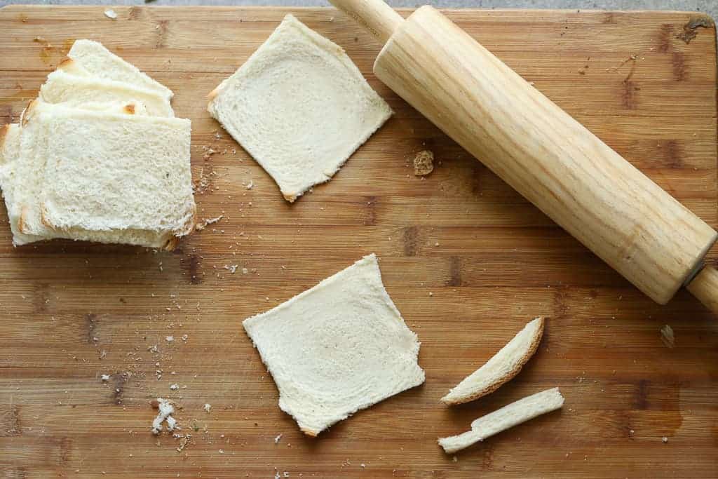 Slices of bread rolled flat with a rolling pin.