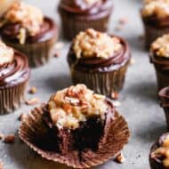 German Chocolate Cupcakes with a bite taken out of one.