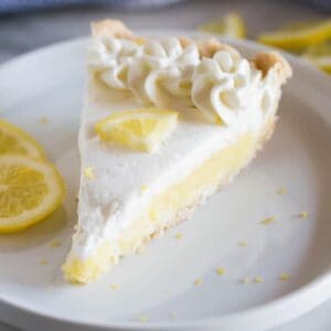 A slice of the BEST Lemon Sour Cream Pie - tastesbetterfromscratch.com