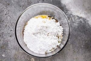 The ingredients for chocolate frosting, in a mixing bowl.