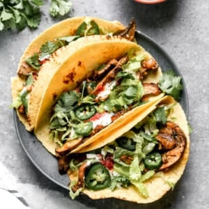 Three easy Mushroom Tacos on a plate, ready to enjoy.