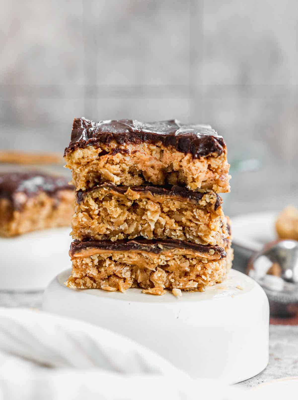 Three peanut butter bars stacked on top of each other.