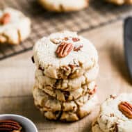 A stack of homemade pecan sandies cookies.