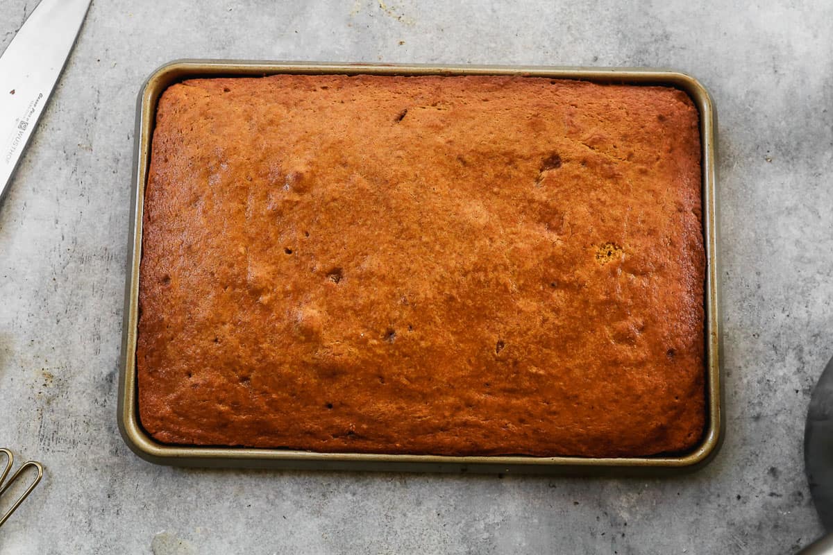 Soft Pumpkin Bars fresh out of the oven on a 10x15 baking pan.