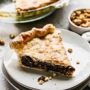 A slice of Raisin Pie on a plate.