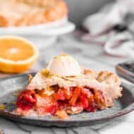 A slice of rhubarb pie on a plate.