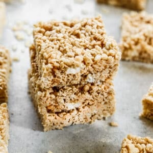 Three browned butter Rice Krispie Treats stacked on top of each other.