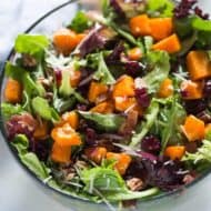 Roasted Butternut Squash Salad with pecans, bacon, onion, craisins, parmesan cheese and a simple balsamic vinaigrette. | tastesbetterfromscratch.com