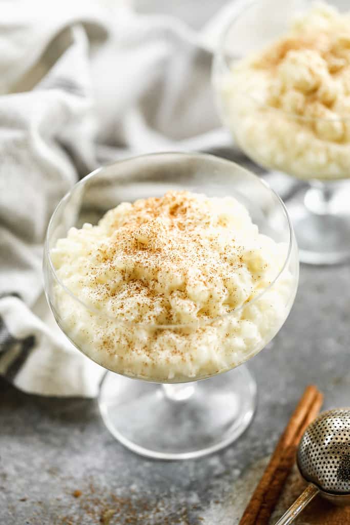 A serving glass with tapioca pudding in it.