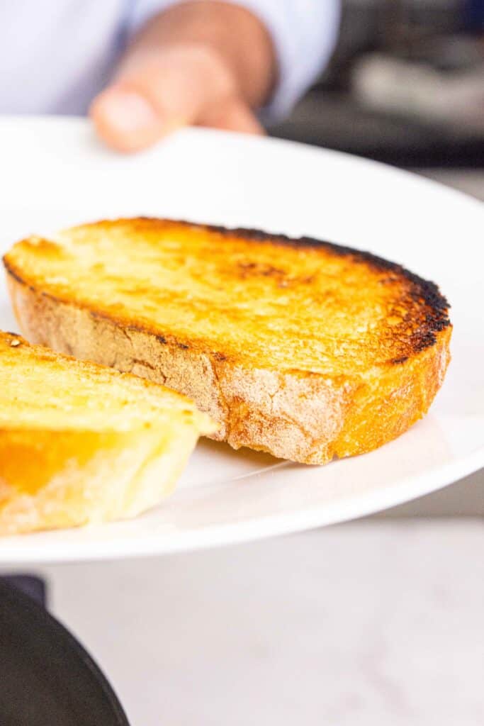 Toasted bread on a plate.