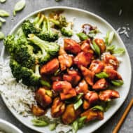 The best Teriyaki Chicken recipe on a bed of hot cooked rice with steamed broccoli.