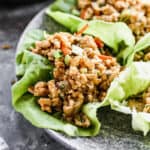 A close up image of a Thai Chicken Lettuce Wrap, ready to enjoy.